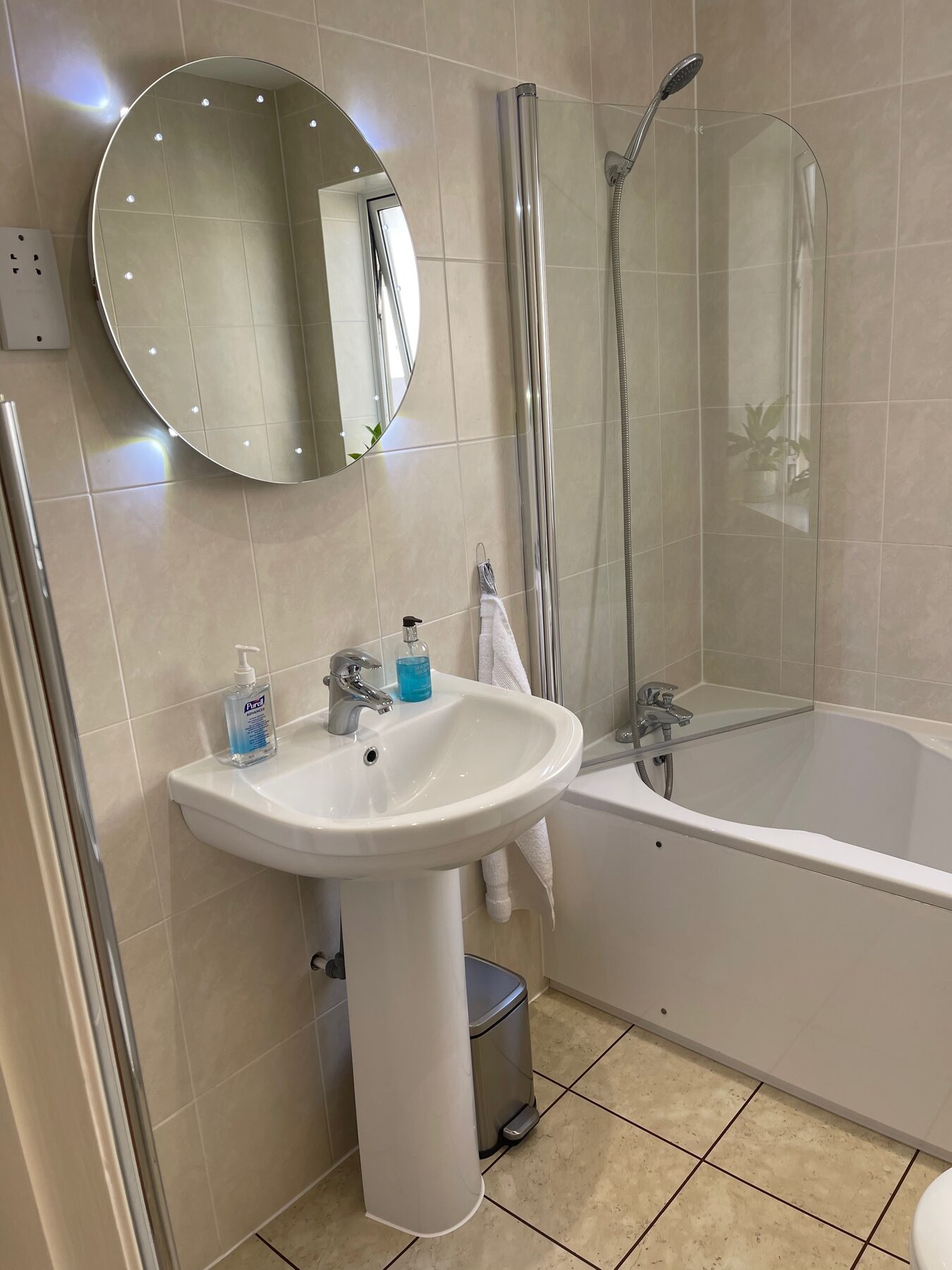 Shared bathroom with bath and shower