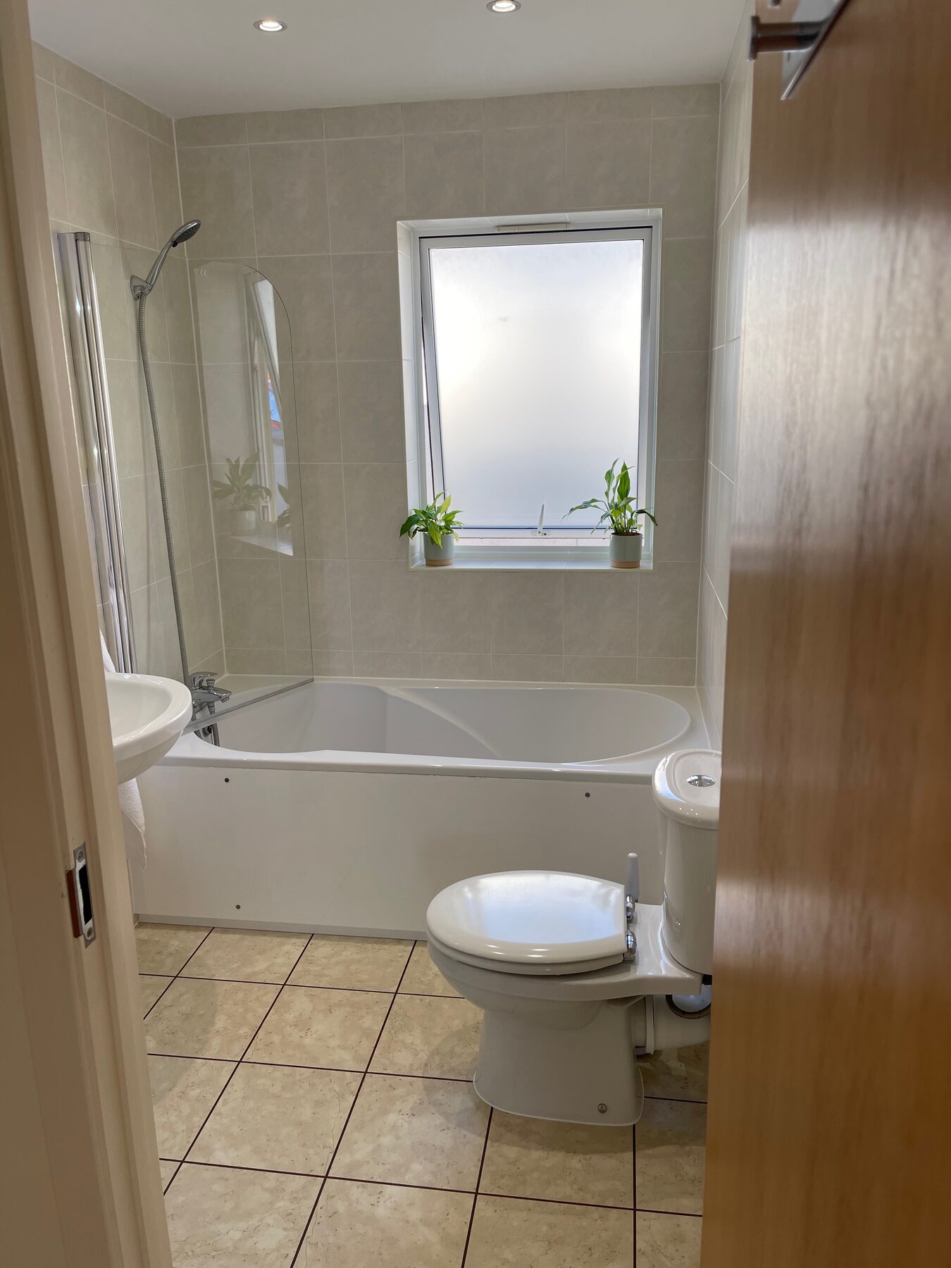 Bathroom bath and toilet, alternate angle